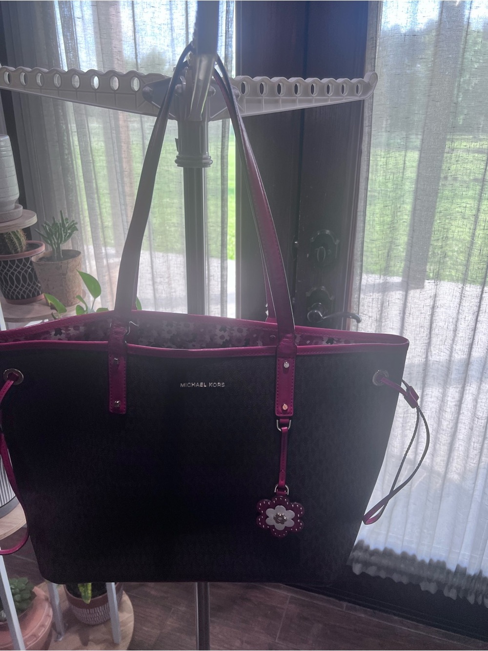 Michael Kors Black Tote with Fuchsia Trim and Flower Charm